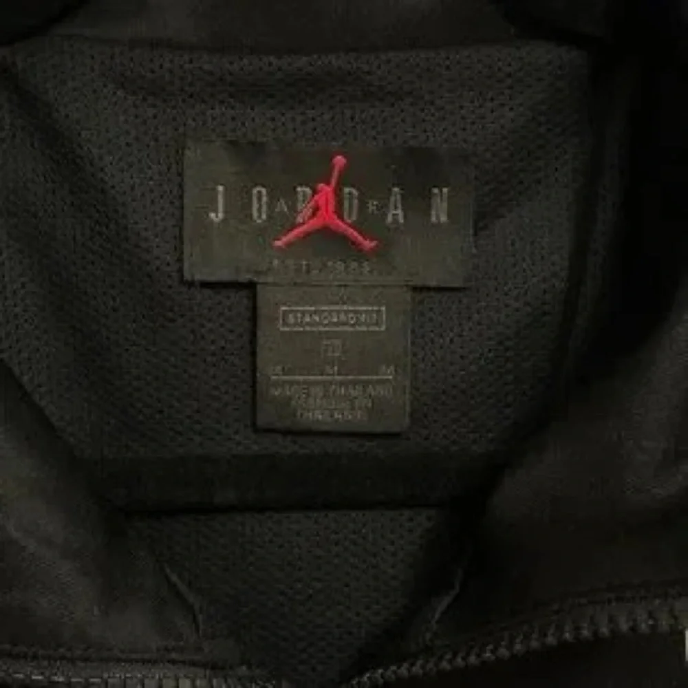 Jordan Black and White Performance Track Jacket with Red Logo